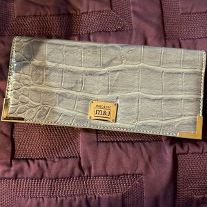 Wallet 8 1/2 inches width, 4 inches height, quarter inch wide
